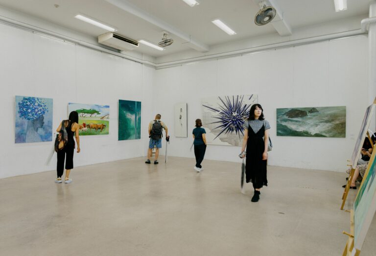 Explore diverse artworks in a contemporary Tokyo gallery setting.